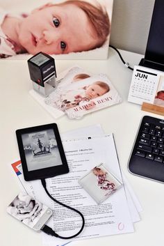 a baby's first year photo and other items on a desk