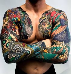 a man with tattoos on his arms and chest