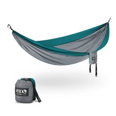 a hammock with a bag on the ground and it's side open