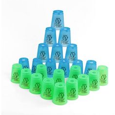 a group of blue and green cups sitting next to each other