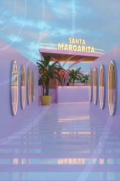 an entrance to the santa margarita hotel with palm trees