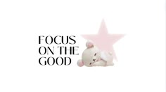 a white teddy bear sitting next to a pink star on top of the words focus on the good