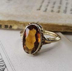 Beautiful 1950s vintage silver citrine ring, US Size 6 3/4, in good vintage condition. Box on the photos not included! Diameter: approx. 15 mm (0.6 inch) Material: 800 silver, citrine total weight: 3.3 g US Size: approx. 6 3/4 (EU size 54) A stunning religious shop well worth a visit ... https://etsy.me/2NNNK4g Vintage Citrine Ring, Vintage Topaz Jewelry For Wedding, Vintage Yellow Wedding Rings, Antique Topaz Jewelry, Vintage Topaz Bridal Jewelry, Vintage Oval Topaz Rings, Vintage Topaz Rings For Anniversary, Vintage Topaz Wedding Rings, Vintage Topaz Birthstone Ring For Anniversary