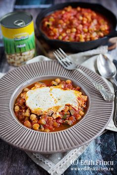 a plate with beans and an egg on top