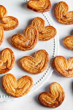 some heart shaped cookies on a white plate