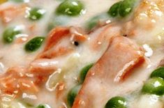 peas and ham are mixed together in a casserole with cheese, sauce, and seasonings