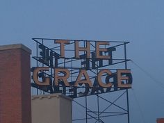 a large sign that says the grace on top of a building