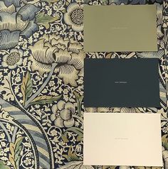 two different shades of gray and green on a floral wallpaper pattern with matching paint swatches