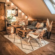 a living room filled with lots of furniture and decor on top of a wooden floor