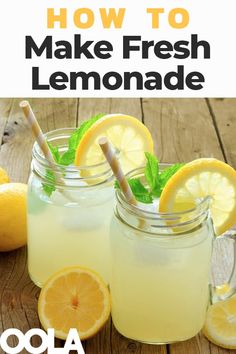 two mason jars filled with lemonade sitting on top of a wooden table next to sliced lemons