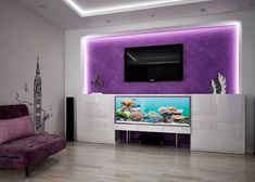 the living room is decorated in purple and white with a fish tank on the wall