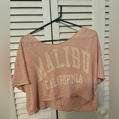 Never Worn Off The Shoulder Style Soft Top Malibu California Pink Tee Spring Vacation Crew Neck Crop Top, Casual Beach Crop Top With Crew Neck, Casual Crew Neck Crop Top For Beach, Casual Crew Neck Crop Top For Vacation, Spring Beach Crop Top With Crew Neck, Casual Beach Crop Top T-shirt, Trendy Crop Top T-shirt For Beach, Casual Crew Neck Crop Top For Beach Season, Casual Beach Crop Top With Graphic Print