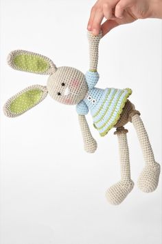 a crocheted bunny hanging from a string with the text, free pattern by lillie's frilly - pants bunny