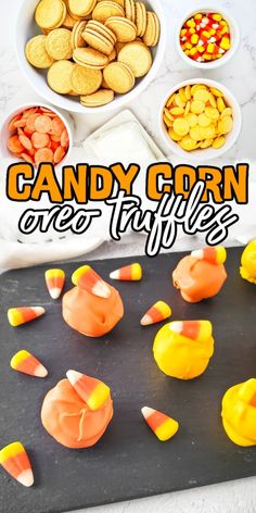 candy corn and other candies on a tray with the words candy corn over it