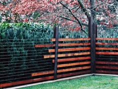 the fence is made out of wood and metal