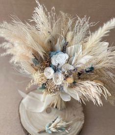 Icy Blue Whispers Blue Cream Wedding Theme, Blue Boho Wedding Flowers, Winter Wonderland Bouquet Wedding, Powder Blue Boho Wedding, Light Blue Country Wedding, Blue Bonnet Wedding, Tan And Blue Wedding, Beach Wedding Flowers Bouquet, Steel Blue Wedding