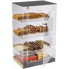 a clear display case filled with lots of different types of cigars and other items