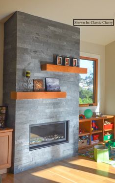 a living room filled with furniture and a fire place in front of a large window