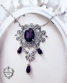 Beautiful silver ornaments decorated with purple gem Gothic Filigree Necklace For Wedding, Gothic Filigree Wedding Necklace, Gothic Wedding Necklace With Filigree Detail, Gothic Sterling Silver Jewelry With Intricate Design, Gothic Filigree Pendant Jewelry, Gothic Sterling Silver Necklace, Gothic Filigree Necklaces For Gifts, Gothic Antique Silver Jewelry For Formal Occasions, Gothic Purple Metal Jewelry