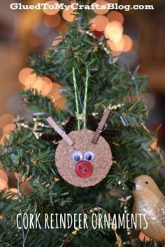 an ornament hanging from the top of a christmas tree