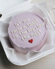 a cake in a box with writing on it