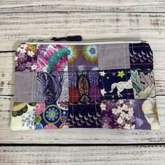 the zippered pouch has many different designs on it