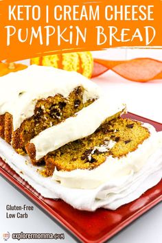 two slices of cake sitting on top of a red plate with white frosting and pumpkins in the background