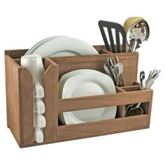 a wooden dish rack with utensils in it