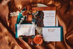 the wedding stationery was done in teal, orange and gold with an art deco theme