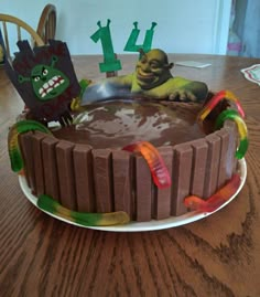 a birthday cake with chocolate frosting and decorations