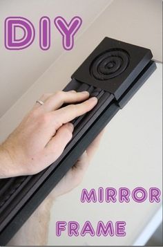 a person holding a black object with the words diy in front of it and below it