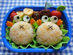 a blue tray with rice krispy kreme treats in the shape of birds