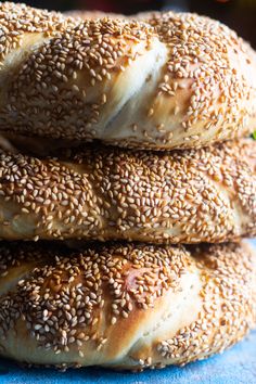 sesame seed bagels stacked on top of each other