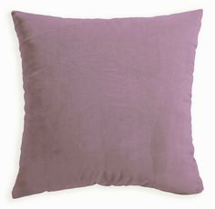 a purple pillow on a white background