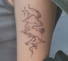 a woman's arm with a tattoo design on the left side of her body