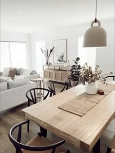 a wooden table sitting in the middle of a living room