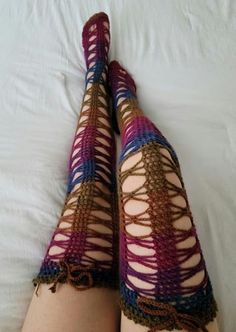 a woman's legs with crocheted stockings on