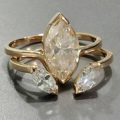 a ring with three pear shaped diamonds on it