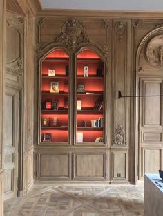 an ornately decorated room with bookshelves and shelves