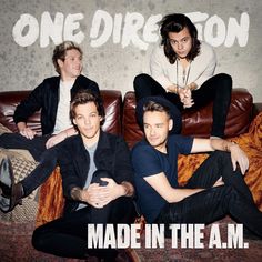 the one direction band is sitting on a couch with their arms around each other and texting made in the am