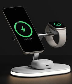 an apple watch and charging station on a black background