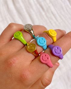 The happiest ring! Choose from 5 vibrant colors or go simple with silver & gold! Each ring is composed of a brass base and is either plated in 14K gold, rhodium or paint. Adjustable, one size fits all (open back). Smile Jewelry, Emoji Jewelry, Seed Kit, Smiley Emoji, Face Jewellery, Seed Bead Bracelets, Jewelry Plate, Be Happy, One Size Fits All