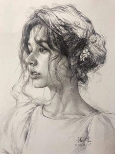 a pencil drawing of a woman's head with her hair in a bunt