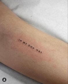 a woman's arm with the words in my own way tattooed on it