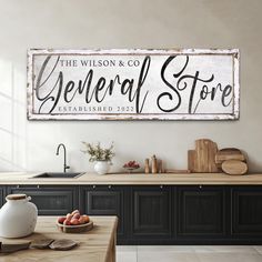 a sign that says the wilson & co general store is displayed above a kitchen counter