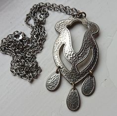 Traditional Scandinavian folk art pendant necklace, hand crafted embossed pewter pendant necklace made in Sweden in the 1990s. Chain is 70 cms long. Pendant is 8x3,5 cms in height/width. High quality pewter alloy from the 1990s! This type of alloy will not need so much polish and maintenance as often are the case with older pewter alloys. It also have a more light silvery and is less grey than older alloys sometimes may be. A true stunner, really!  Suitable as a fine gift for her with Scandinavi Necklace Traditional, Scandinavian Jewelry, Scandinavian Folk Art, Pewter Pendant, Mid Century Jewelry, Art Pendant, Traditional Jewelry, Vintage Gifts, Folk Art