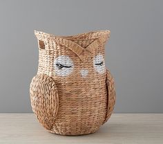 an owl shaped basket sitting on top of a table