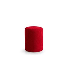 a red round object sitting on top of a white surface