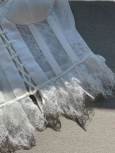 The branches, leaves and flowers are adjusted and modified with some traditional patterns, and the wiring is fresh and elegant. The unique three-dimensional texture of the embroidery matches the complex beauty of the lace, adding details to the overall skirt. 
 The embellishment of lace brings out the proportions of the lower body, and it will not feel monotonous because of the solid color and embroidery. The hazy and transparent texture of the skirt maximizes the beauty of wanting to resist and Fitted Lace Corset With Contrast Lace Details, Elegant Lace Dress With Lace Trim For Wedding Night, Elegant Organza Lace For Ceremony, Fitted White Lace Top With Contrast Lace, White Fitted Lace Top With Contrast Lace, Feminine Lace Corset With Lace Bodice, Feminine Lace Bodice Corset, Elegant Cotton Lace Top, White Feminine Lace Top