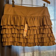 Gianni Bini Nwt Ruffled Mini Skirt (Juniors) Fitted Brown Bottoms With Ruffles, Brown Ruffled Tiered Mini Skirt, Brown Tiered Ruffle Skirt, Spring Brown Skirt With Ruffles, Spring Brown Ruffled Skirt, Fall Ruffled Tiered Skort, Brown Ruffled Skirt, Brown Ruffled Mini Skirt, Tan Mini Skirt